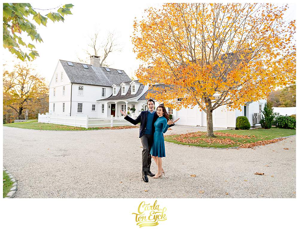 A couple snuggles during their engagement session at Smith Farm Gardens in East Haddam CT