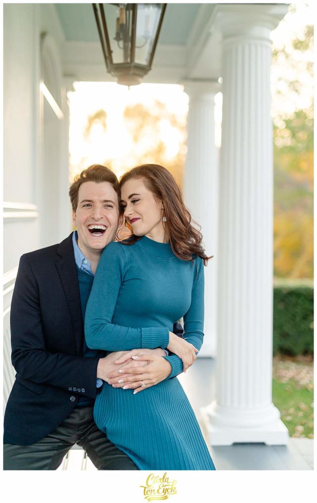 A couple laughs during their engagement session at Smith Farm Gardens in East Haddam CT
