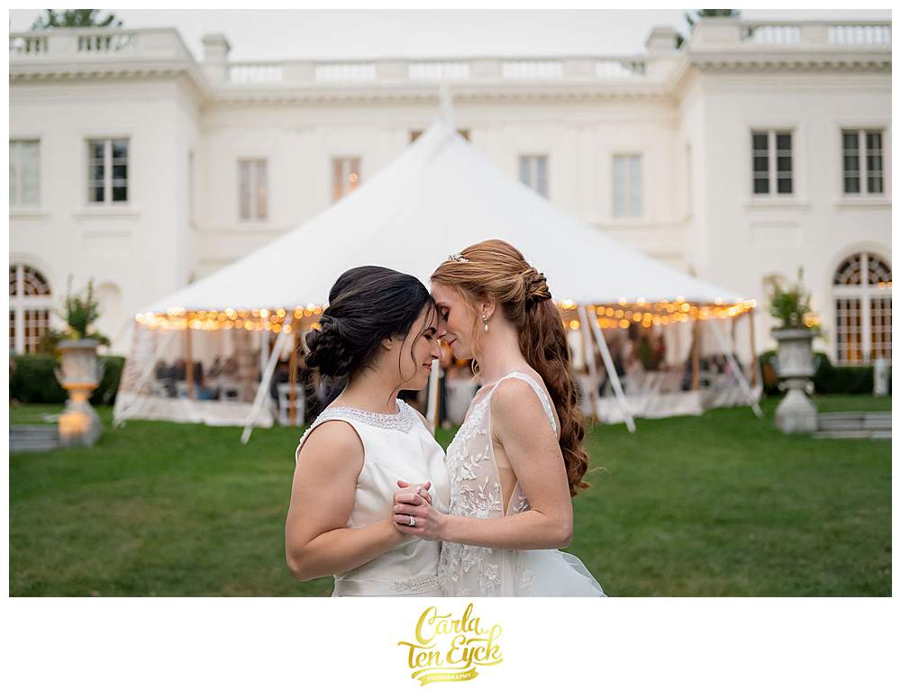 Two brides kiss at their wedding at The Wadsworth Mansion in Middletown CT during COVID