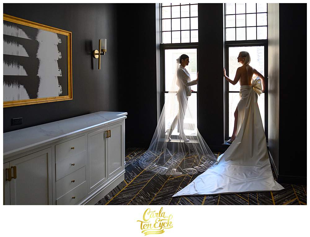 Two brides pose for photos at their wedding during their intimate wedding at the Goodwin Hotel in Hartford CT