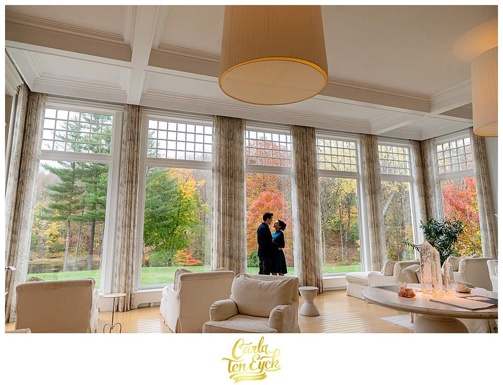 A bride and groom pose for photos at their intimate wedding at the Mayflower Inn and Spa in Washington CT