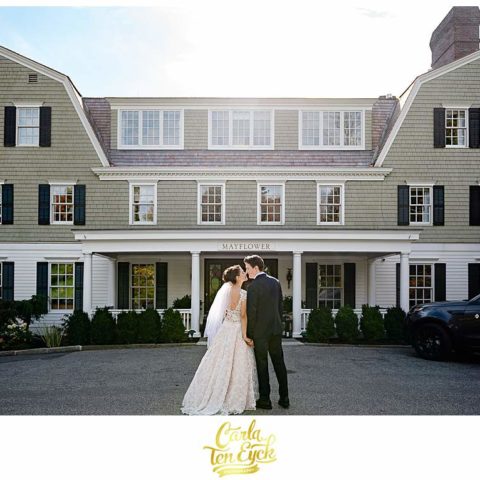 A bride and groom kiss at their intimate wedding at The Mayflower Inn and Spa in Washington CT