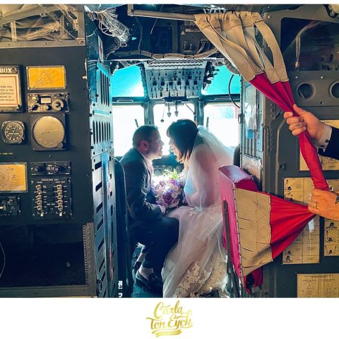 Bride and groom pose in the helicopter suite on their wedding day at the Winvian Farm in Morris CT