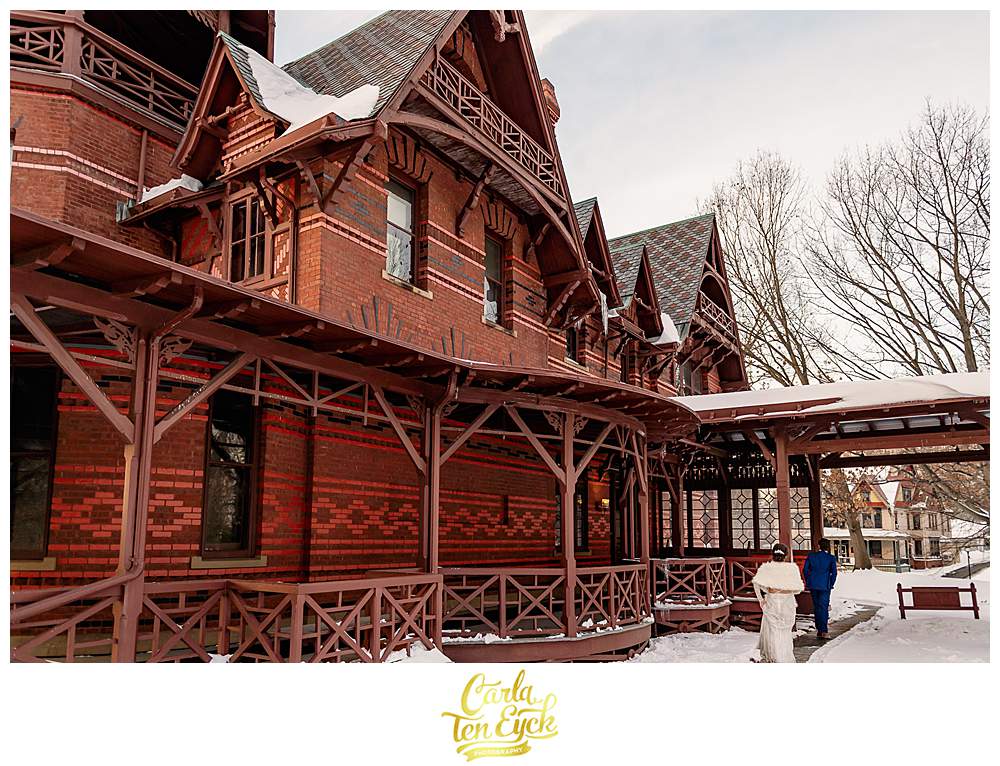 A couple walks on their wedding day at The Mark Twain House in Hartford CT