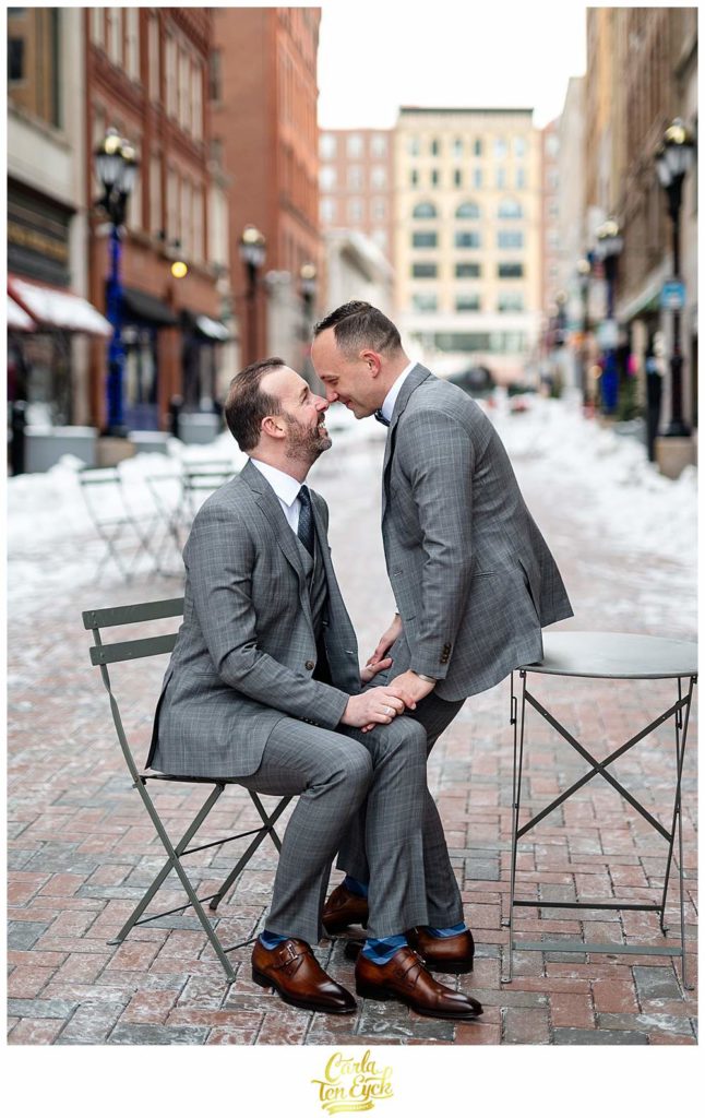 Two grooms take wedding photos on Pratt Street in Hartford CT on their wedding day