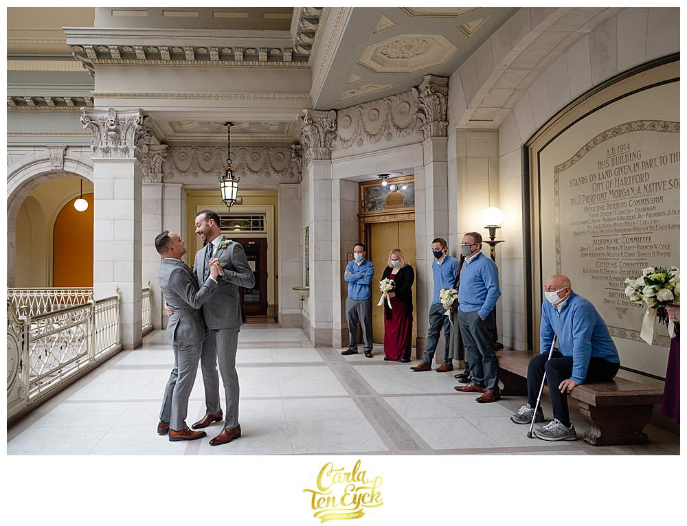 Two grooms dance during their elopement at Hartford City Hall in Hartford CT
