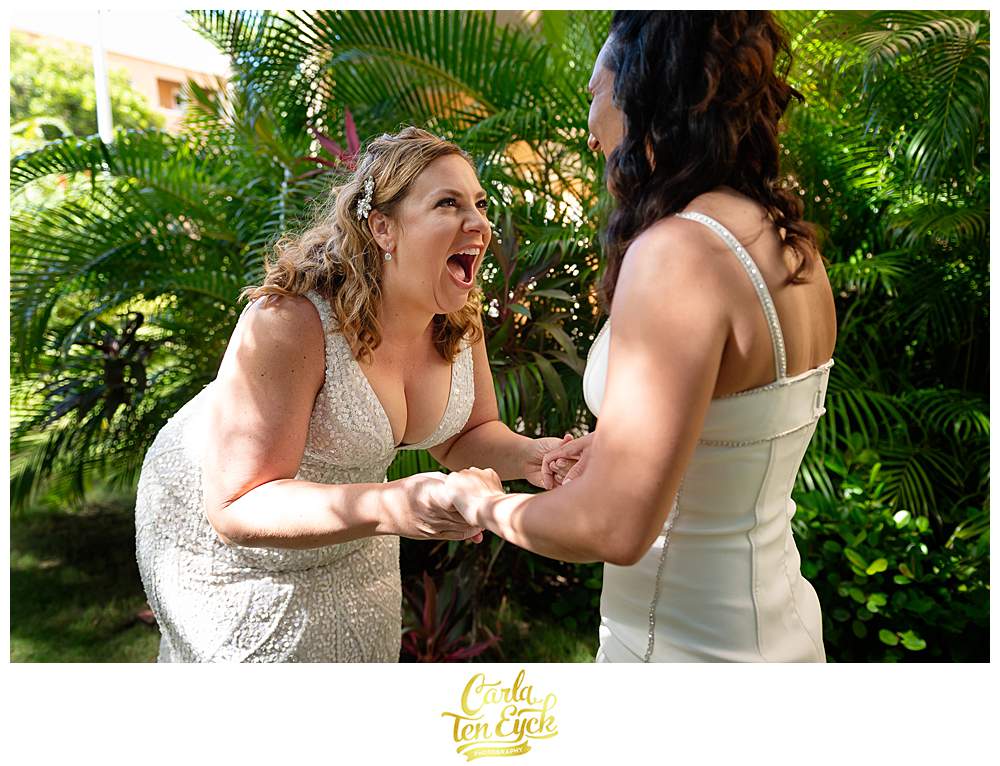 Two brides have their first look at their Aruba Wedding at the Tamarijn Resort