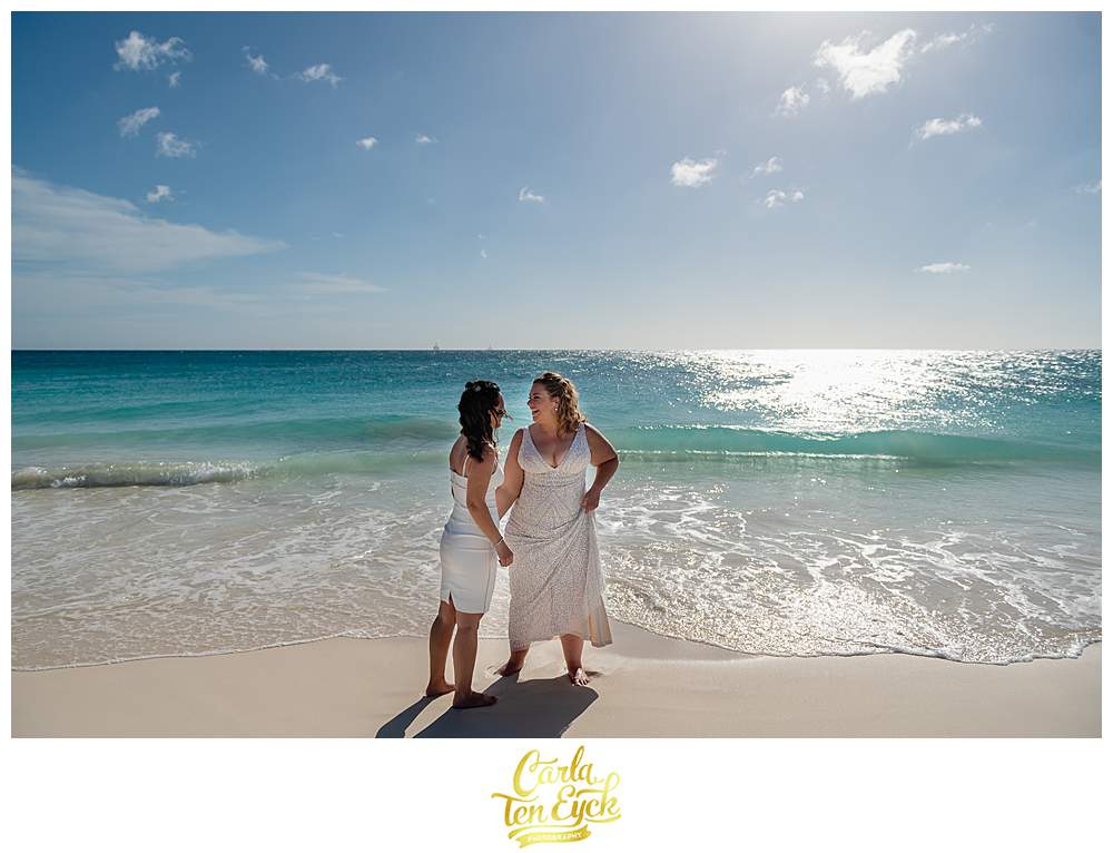 Two brides on the beach for their Aruba wedding at Ricardo's Restaurant and Bar in Aruba