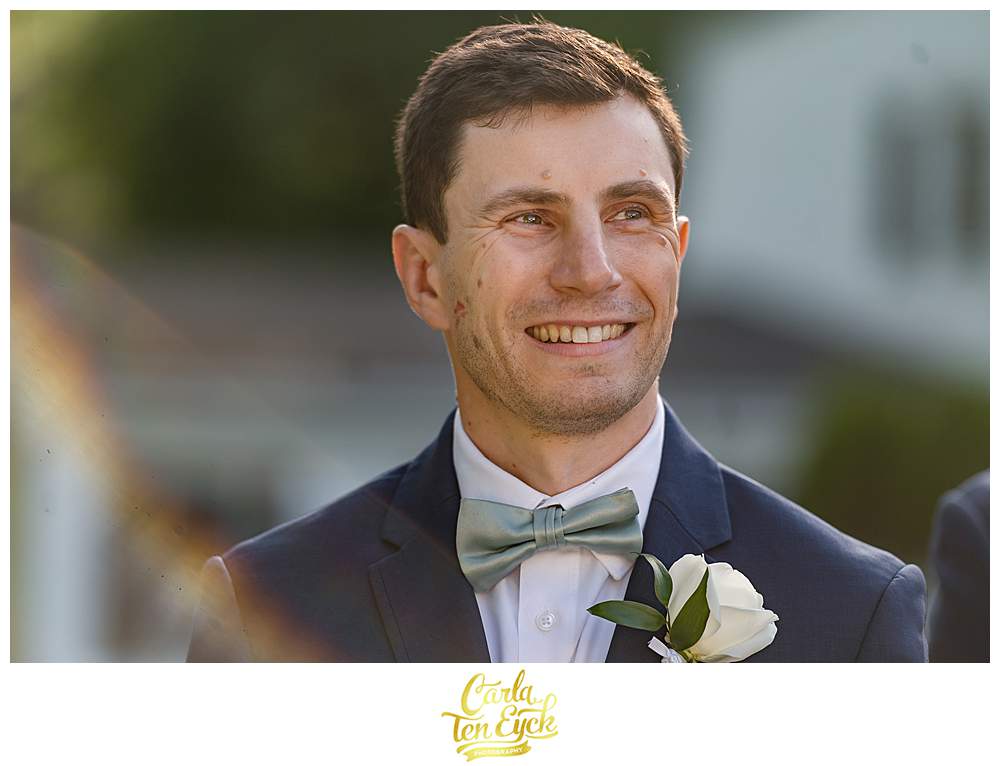 A groom sees his bride walk down the aisle at his Fox Hill Inn Wedding in Brookfield CT