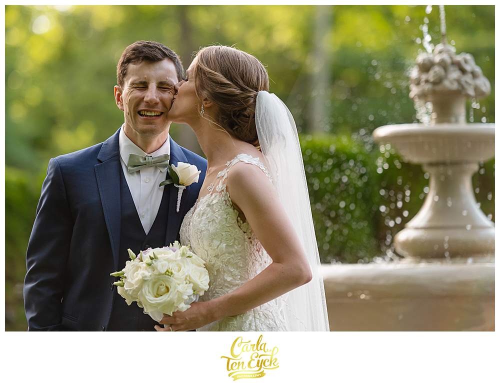 A bride kisses her groom at their Fox Hill Inn Wedding in Brookfield CT