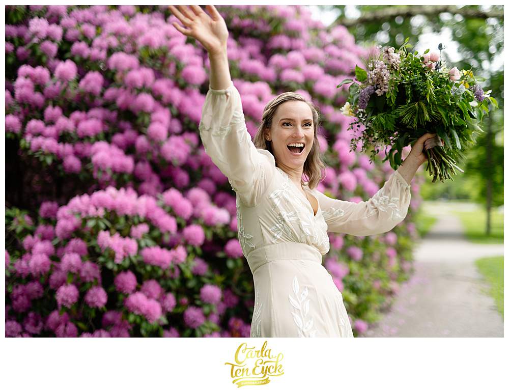 A bride waves at a passerby congratulating her after her Litchfield wedding in Litchfield CT