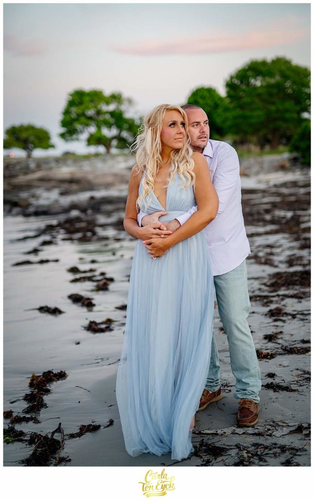 A couple poses for their engagement photos at Great Island Common in Portsmouth New Hampshire