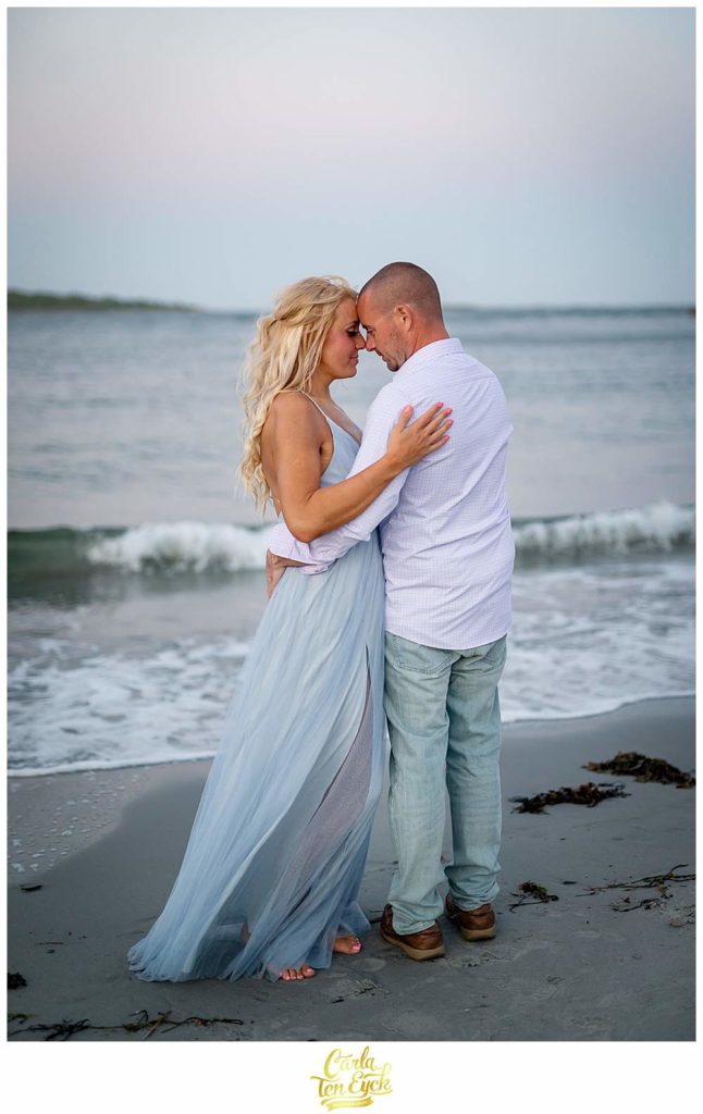 A couple poses for their engagement photos at Great Island Common in Portsmouth New Hampshire