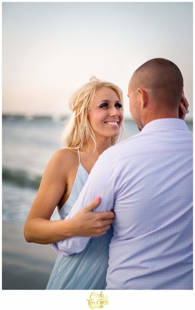 A couple poses for their engagement photos at Great Island Common in Portsmouth New Hampshire