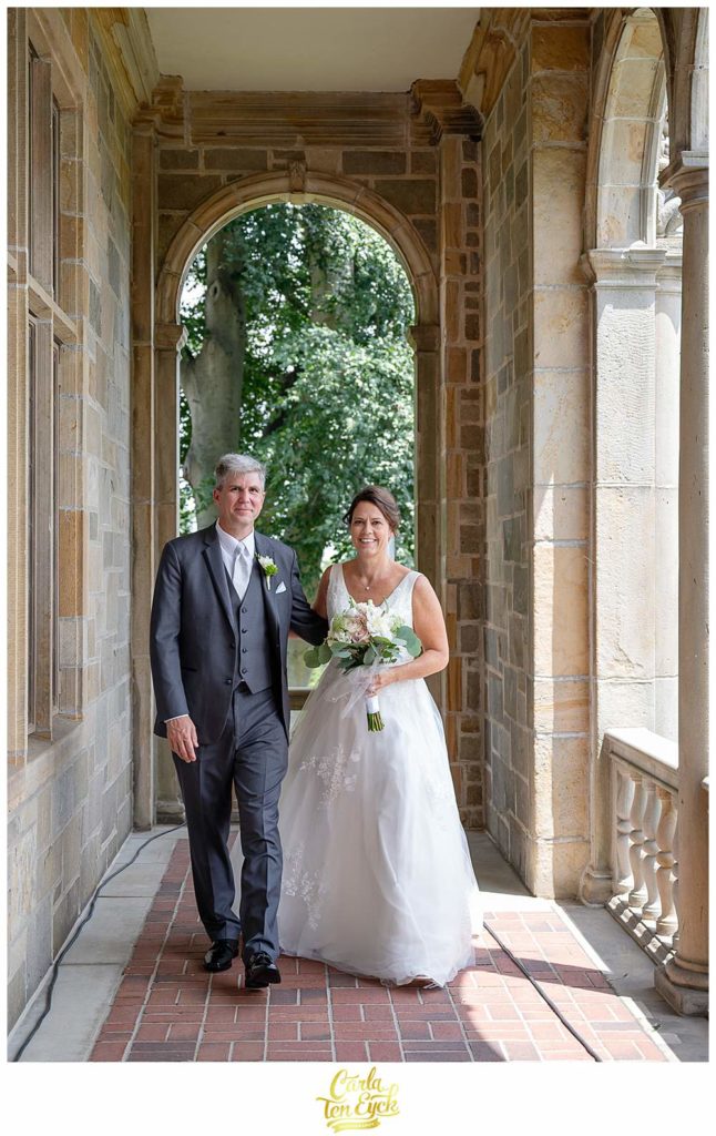 A couple walks after their wedding at Fairfield University in Fairfield CT