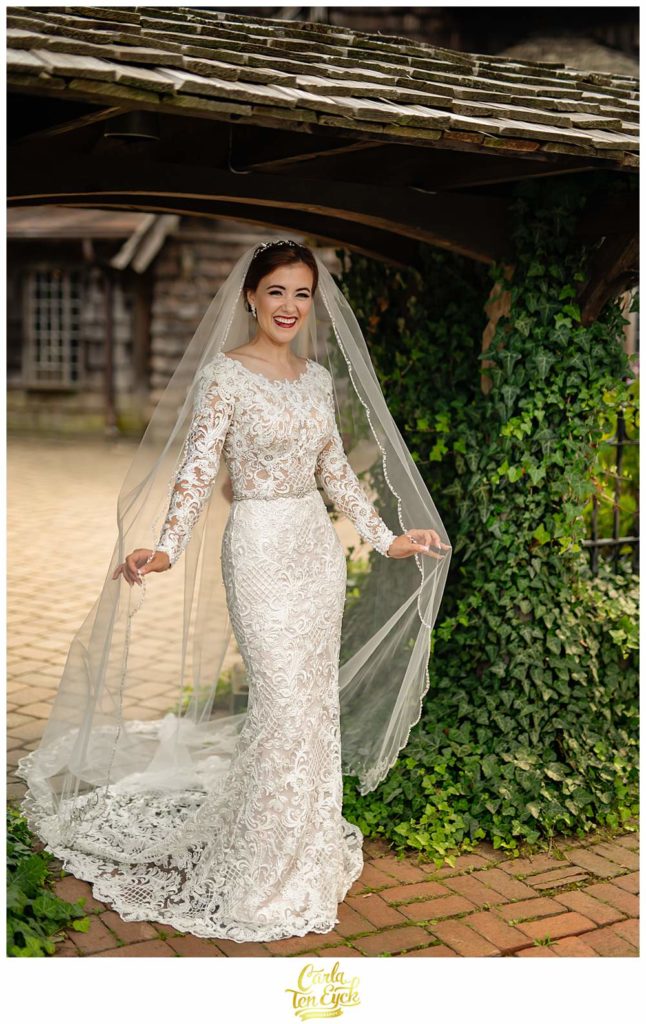 A bride laughs during photographs at her Bill Miller's Castle wedding in Branford CT