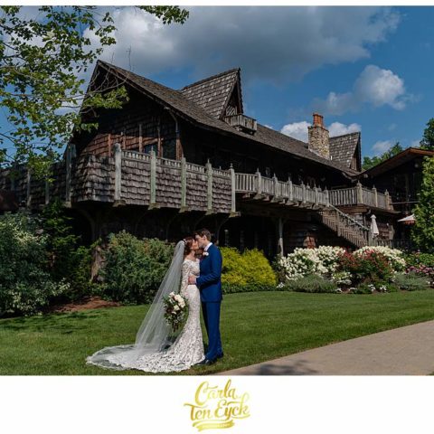 A bride and groom pose for photographs at their Bill Miller's Castle wedding in Branford CT