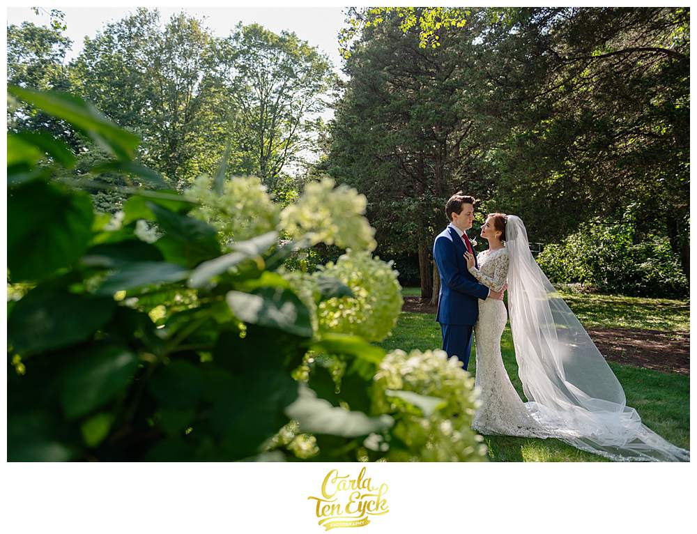 A couple poses for photos at their Bill Miller's Castle wedding in Branford CT
