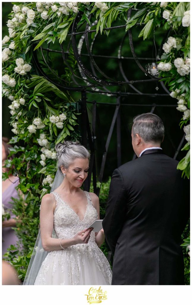 A bride reads her vows during her Lord Thompson Manor wedding in Thompson CT