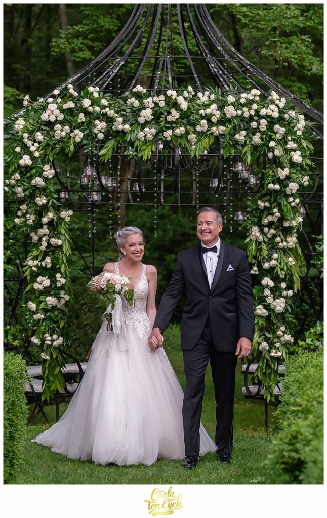 A couple smiles after they are pronounced married at their Lord Thompson Manor wedding in Thompson CT