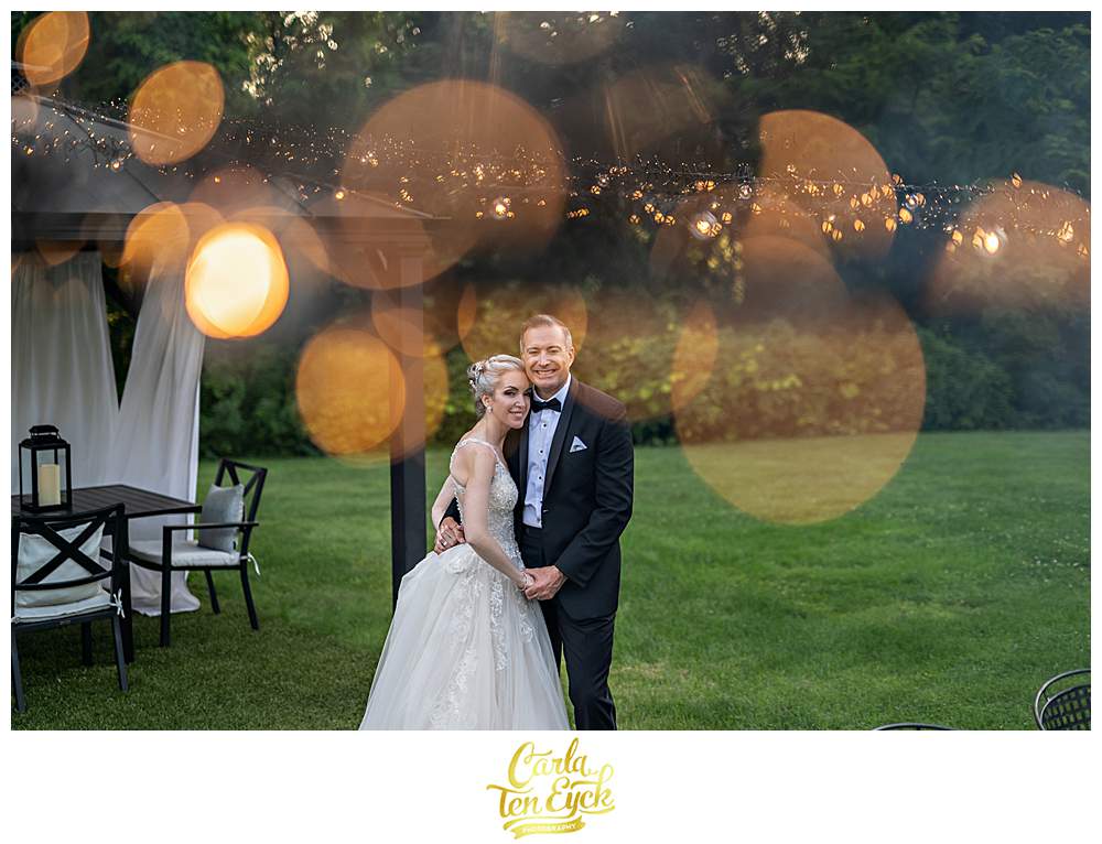 A couple poses for wedding photos during their Lord Thompson Manor wedding in Thompson CT