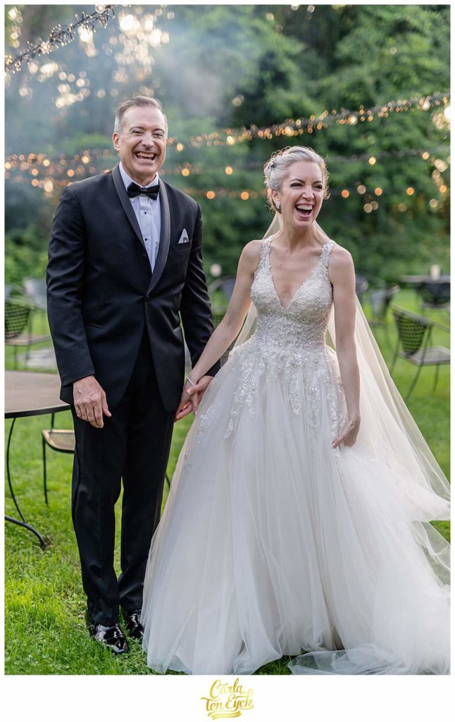 A couple laughs at their Lord Thompson Manor wedding in Thompson CT