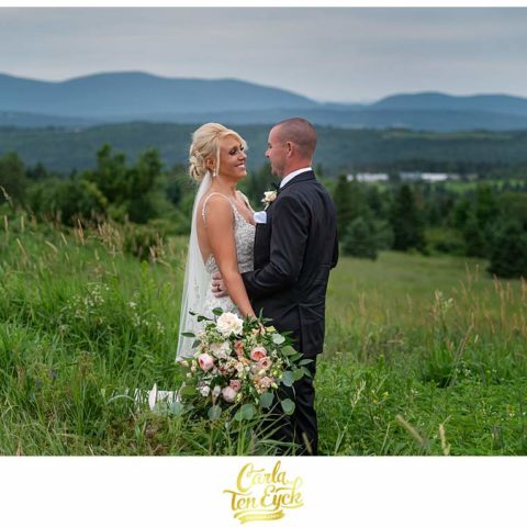 A bride and groom laugh during their New Hampshire wedding