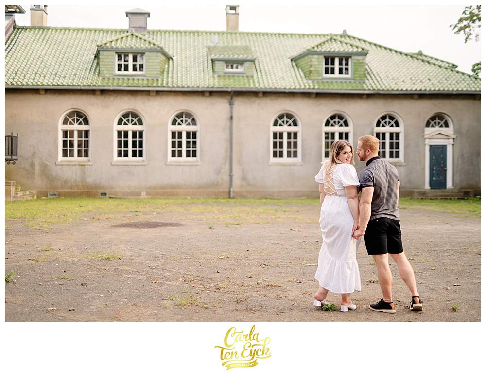 A couple poses for photos at Harkness during their engagement session in Harkness Park in Waterford CT