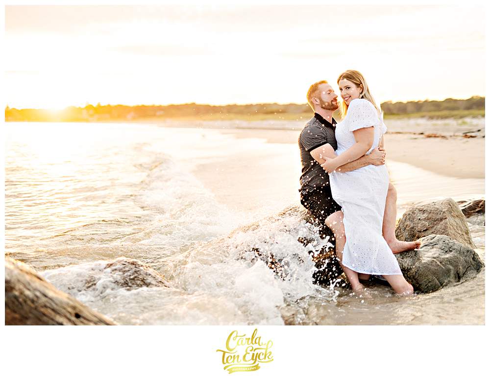A couple poses for their engagement photos at Harkness during their engagement photo session in Waterford CT
