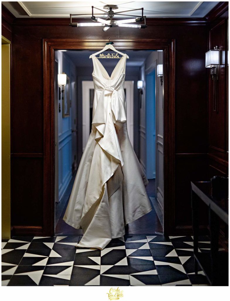 A wedding gown hangs at a Goodwin Hotel wedding in Hartford CT
