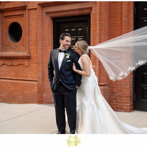 A couple poses for photos at their Goodwin Hotel Wedding in Hartford CT