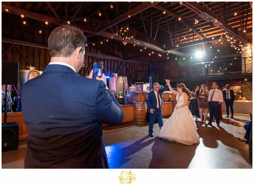 A bride dances with her Dad during her autumn Saltwater Farm vineyard wedding in Stonington CT