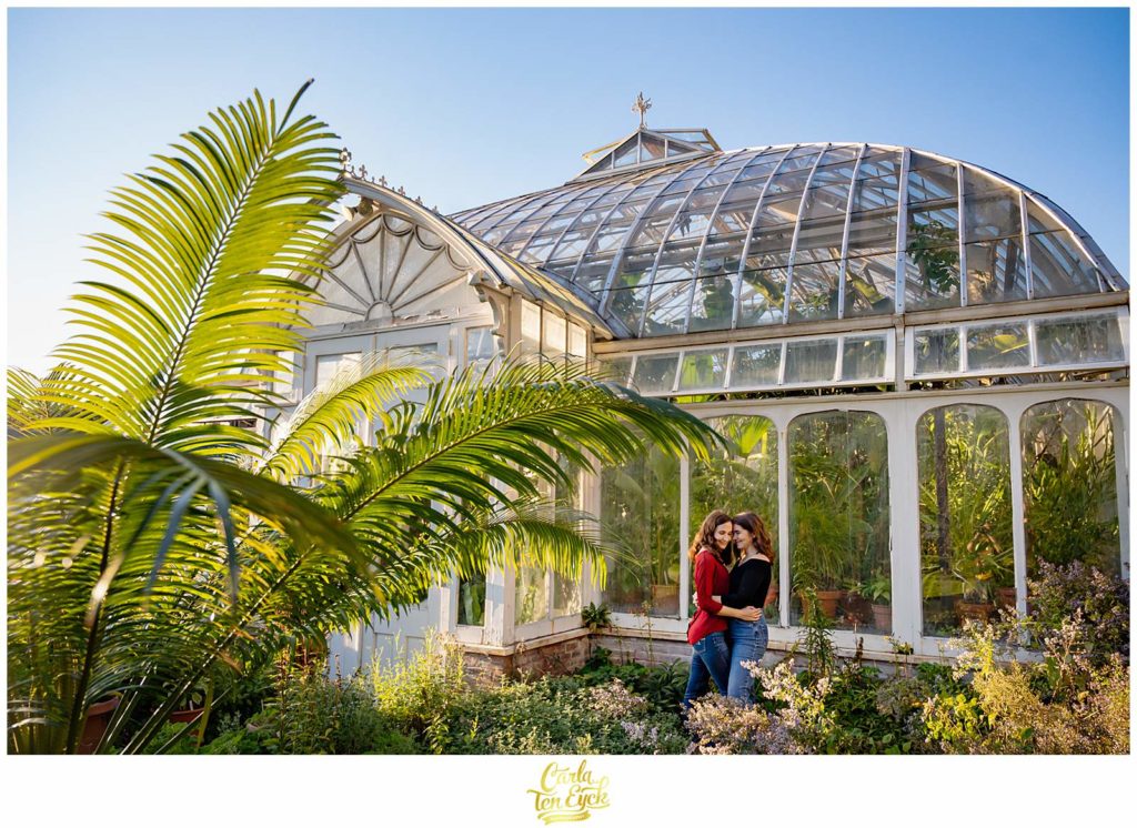 Two brides embrace at their Smith College engagement session in Northampton MA