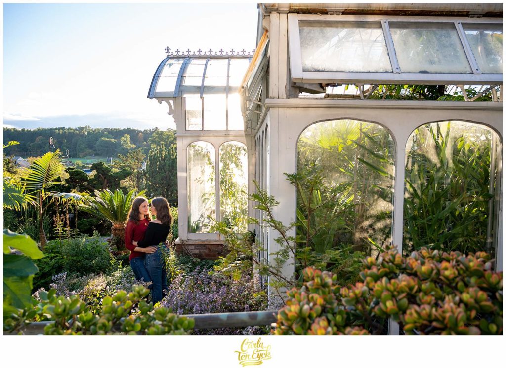 The conservatory on the Smith College campus in Northampton MA is a stunning backdrop for your engagement session .