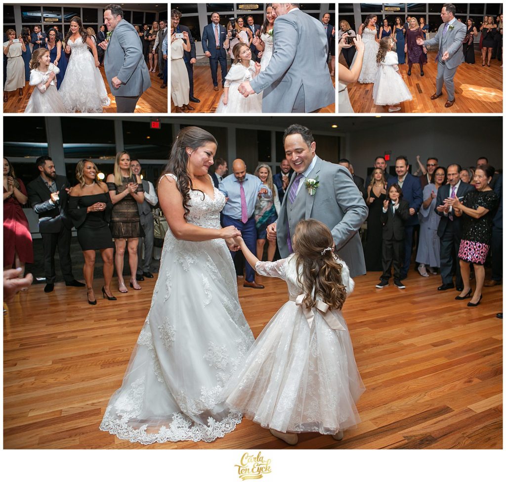 A bride and groom dance with their daughter at their Mamaroneck Yacht Club wedding in Mamaroneck NY
