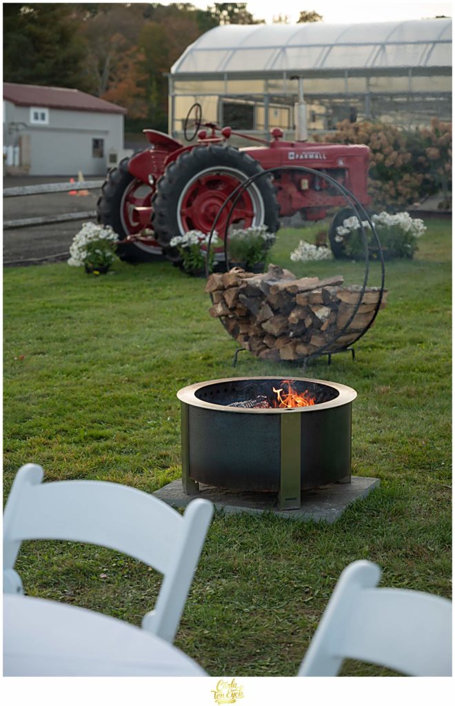 A fire pit during cocktail hour at a Van Wilgen's Garden Center in North Branford CT wedding