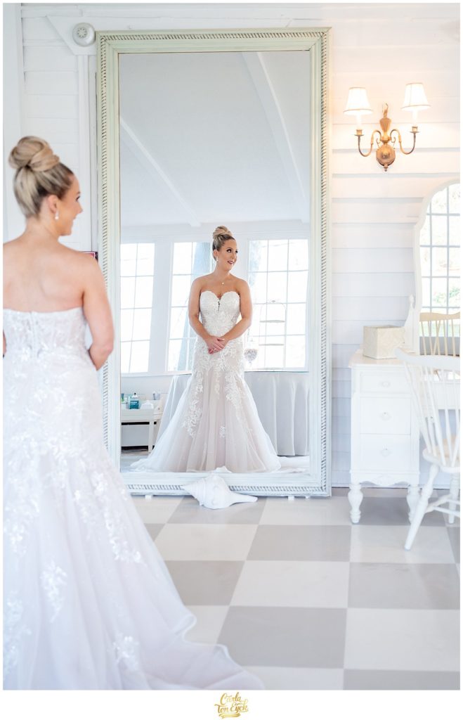 A bride gets ready for her winter Lord Thompson Manor wedding in Thompson CT