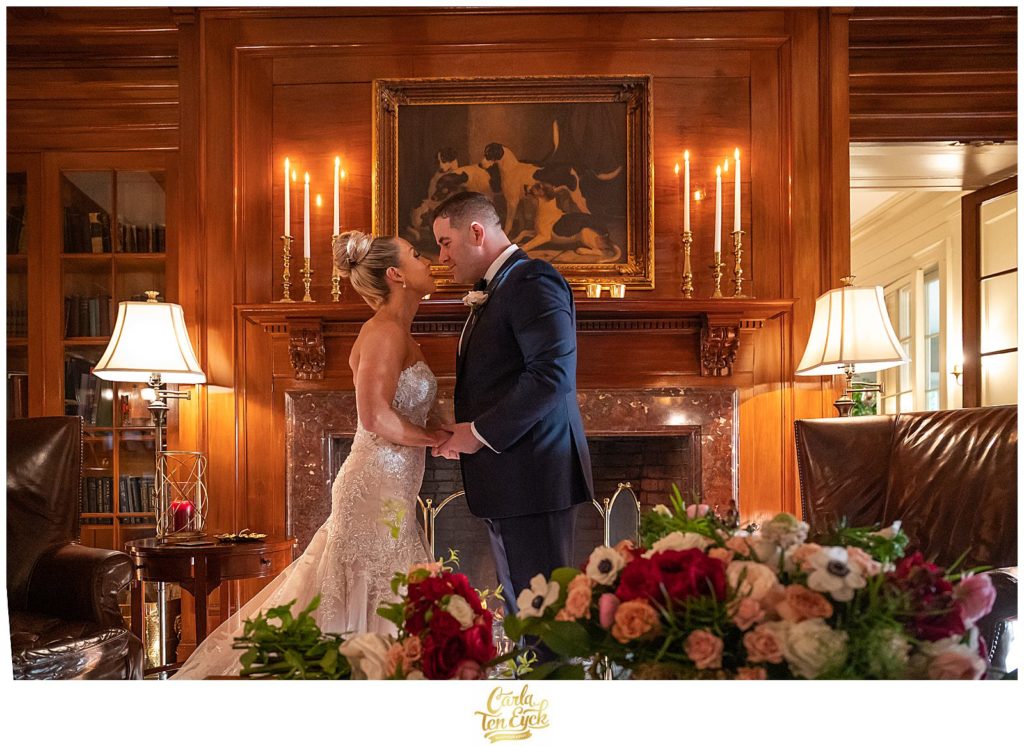 A bird and groom kiss a their winter Lord Thompson Manor wedding in Thompson CT