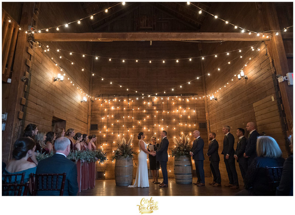 A wedding ceremony at their wedding at The Barns at Wesleyan Hills in Middletown CT