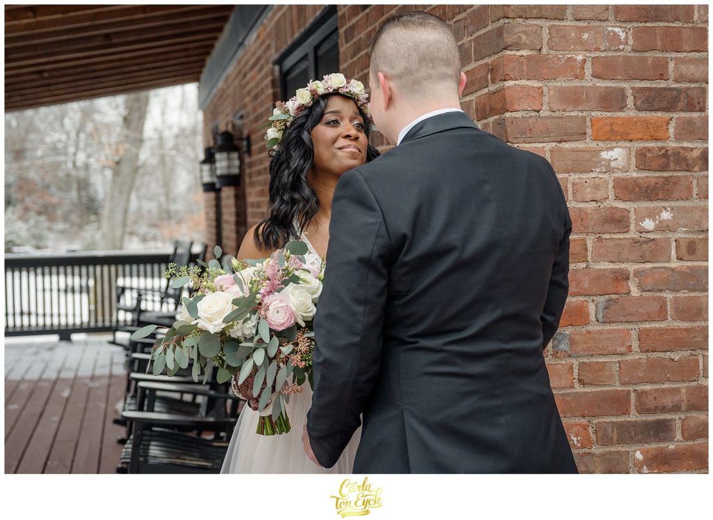 A bride and groom have their first look at wedding at The Pavilion at Crystal Lake in Middletown, CT