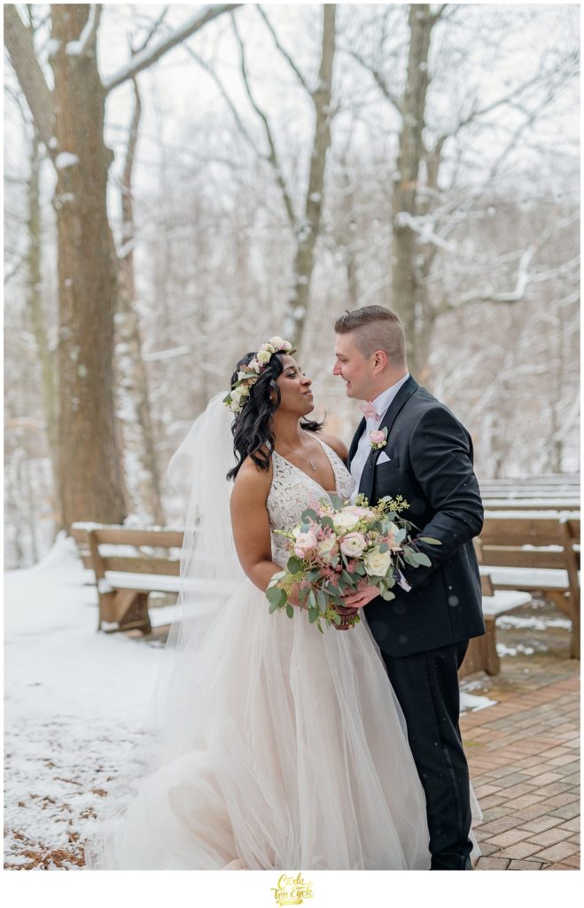 A couple poses for photos during their wedding at The Pavilion at Crystal Lake in Middletown, CT