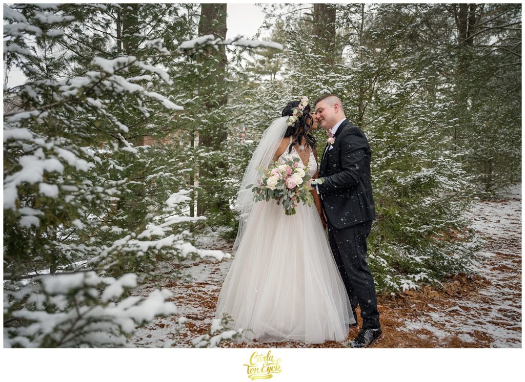 A couple kisses during photos at their wedding at The Pavilion at Crystal Lake in Middletown, CT