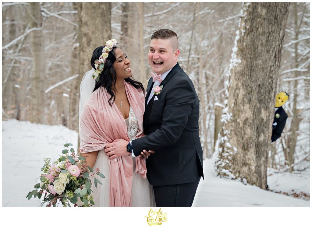 A couple laughs during photos at their wedding at The Pavilion at Crystal Lake in Middletown, CT
