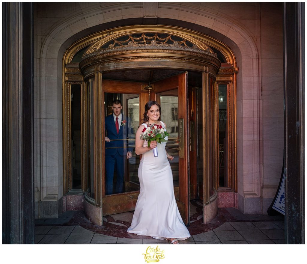 A couple celebrates after their Hartford City Hall Spring elopement, in Hartford CT