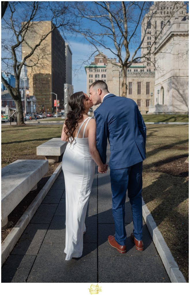 A couple strolls around Downtown Hartford after their Hartford City Hall Spring elopement, in Hartford CT