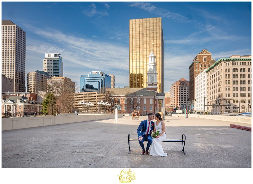 A couple poses in the Bushnell Park Sculpture Garden after their Hartford City Hall Spring elopement, in Hartford CT