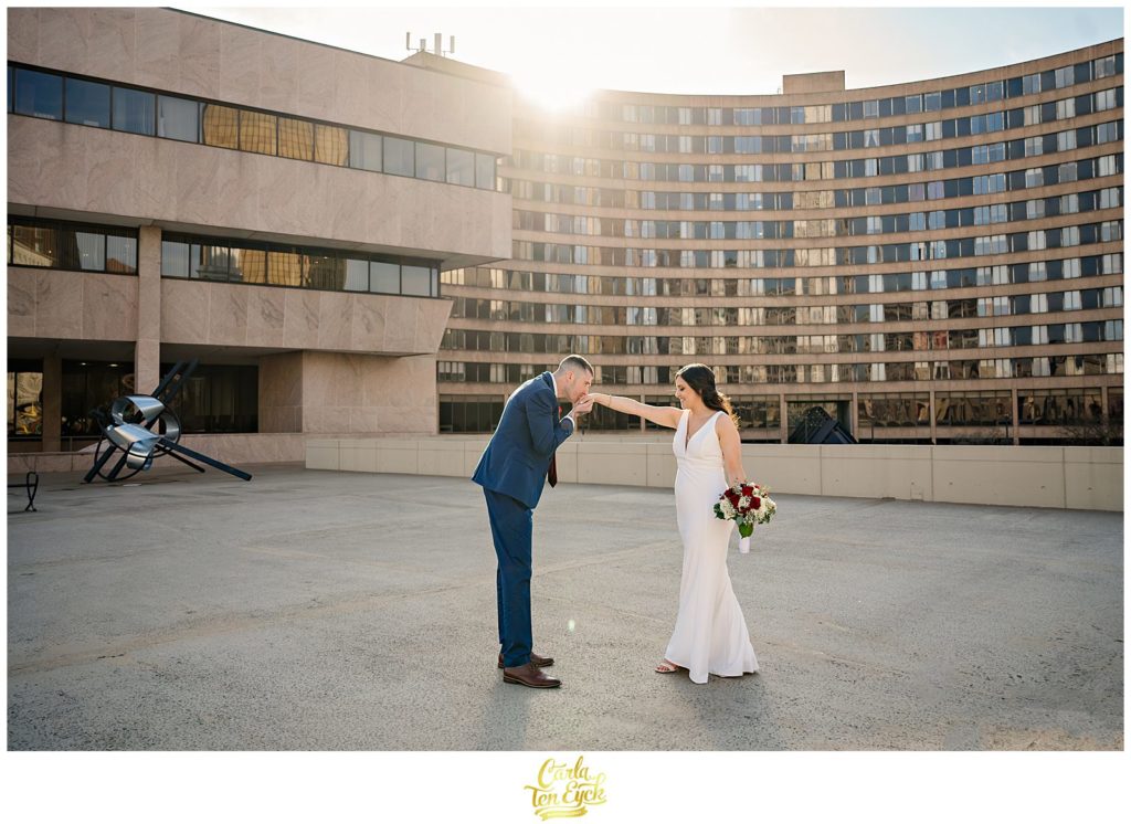 A bride and groom dance during their wedding photos at their Hartford City Hall Spring elopement, in Hartford CT