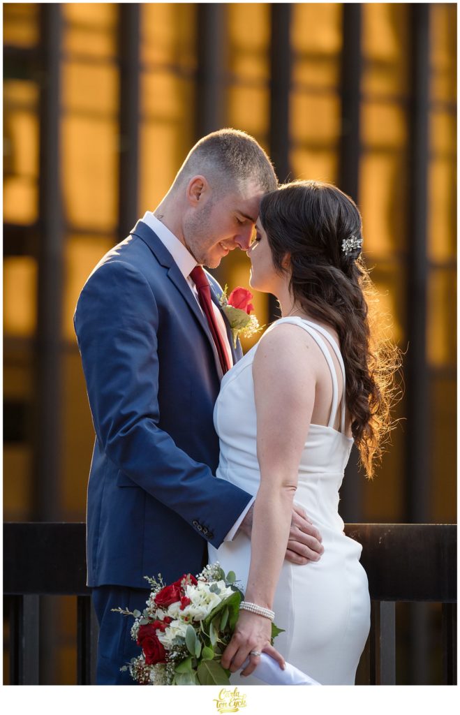 A bride and groom pause during their Hartford City Hall Spring elopement, in Hartford CT