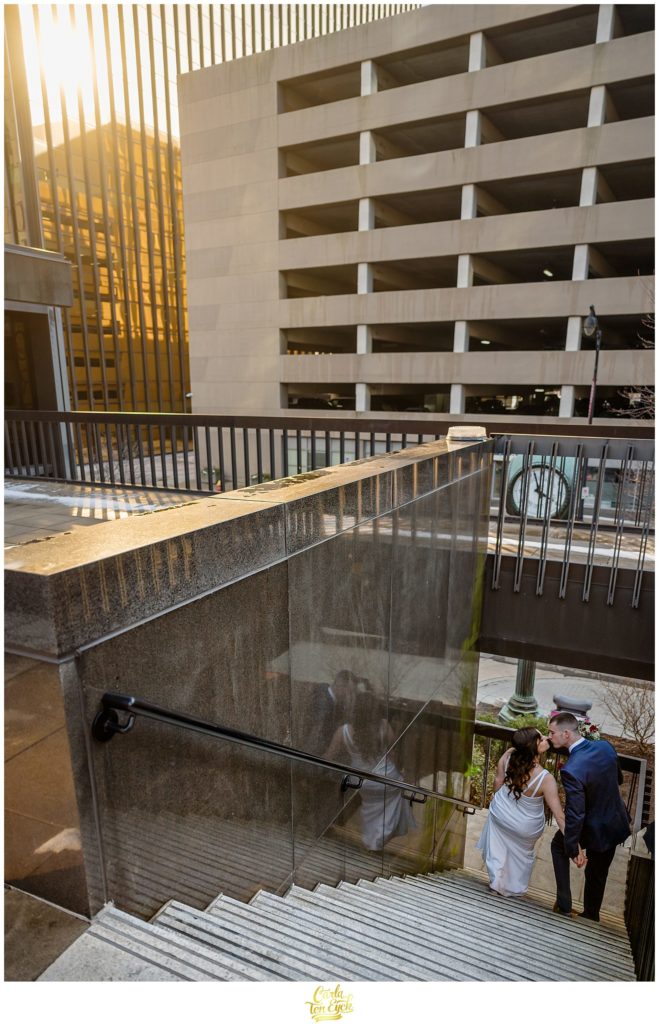 A couple kisses during their wedding photos at their Hartford City Hall Spring elopement, in Hartford CT