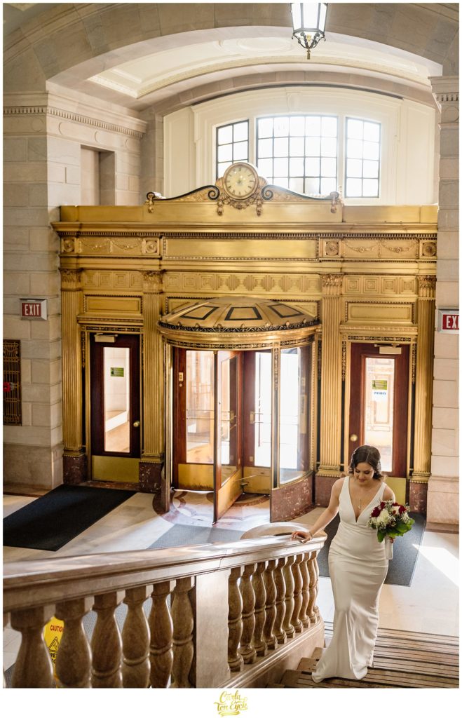 A bride walks into Hartford City Hall for her Hartford City Hall Spring elopement, in Hartford CT